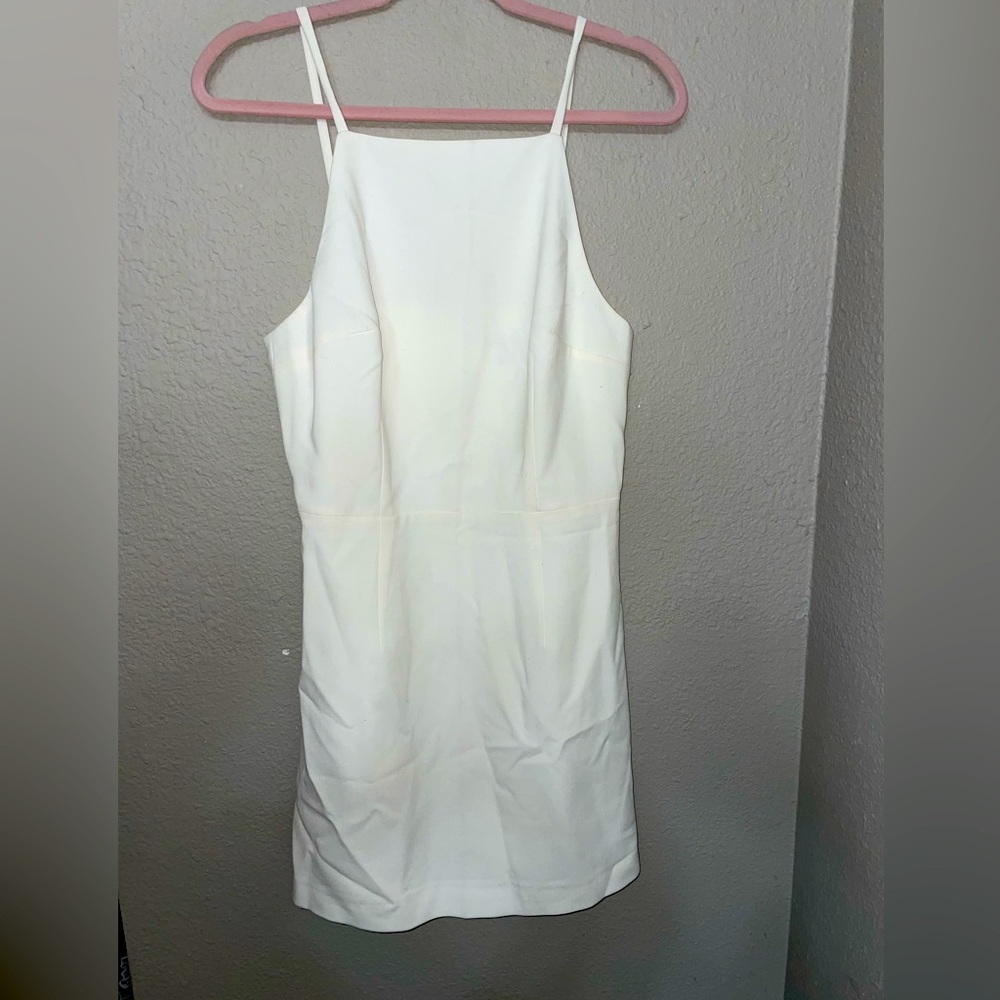 Soft white mini dress. form fitting. thick material. halter style top.